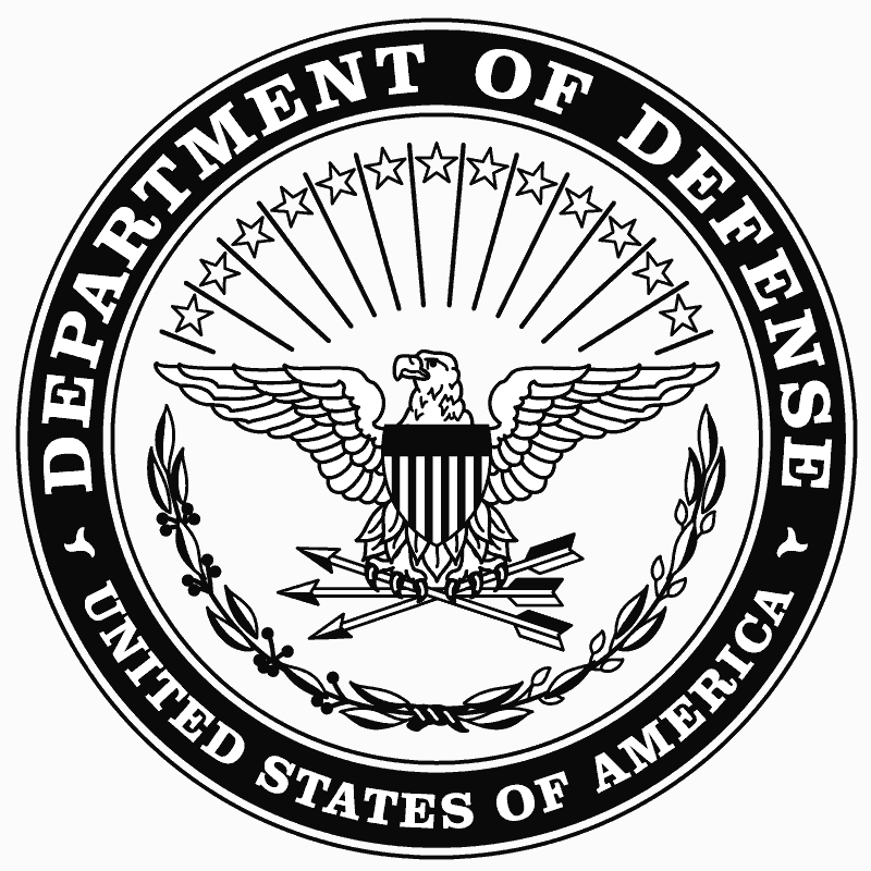 The departmental crest of the U.S. Department of Defense circa 1977.  It depicts a stylized bald eagle with a shield over its breast and three arrows clutched in its talons.  Above the eagle are radiant lines between which are hollow five-pointed stars.  Below the eagle is a laurel branch, which curves to form a near-semicircle.  Along the outside rim of the crest are the words “United States of America” along the bottom, and “Department of Defense” along the top half of the rim.