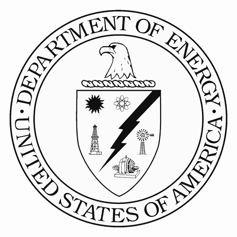 The departmental crest of the U.S. Department of Energy circa 1977.  It has the head of a bald eagle, looking off to the left.  Below that is the outline of a shield.  A cartoon-style black bolt of lightning stretches from the top right corner of the shield downward to the left.  Around this bolt are arranged a symbol of the sun, the atom, an oil derrick, a windmill, and a trubine or generator.  Along the outside rim of the crest are the words “United States of America” around the bottom half of the rim, and “Department of Energy” along the top half.
